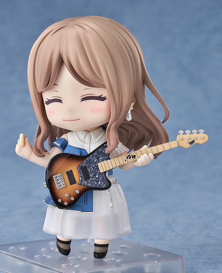 Nendoroid figure of Soyo Nagasaki from BanG Dream! holding a sunburst bass guitar, wearing a blue dress with a white skirt and black shoes.