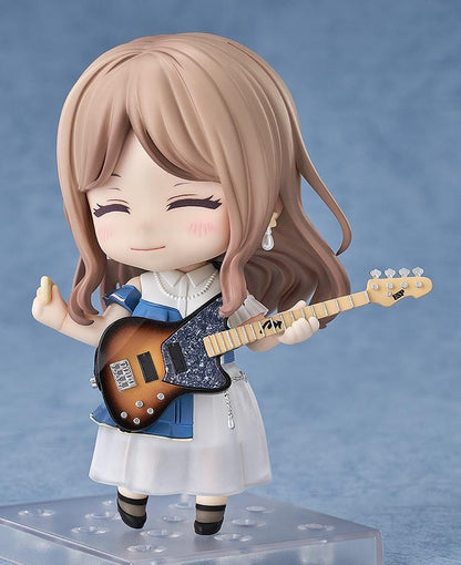 Nendoroid figure of Soyo Nagasaki from BanG Dream! holding a sunburst bass guitar, wearing a blue dress with a white skirt and black shoes.