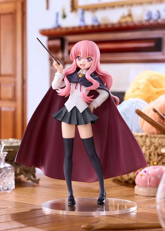POP UP PARADE Louise L Size figure with flowing pink hair, a raised wand, white blouse, dark skirt, and a cape with burgundy lining.