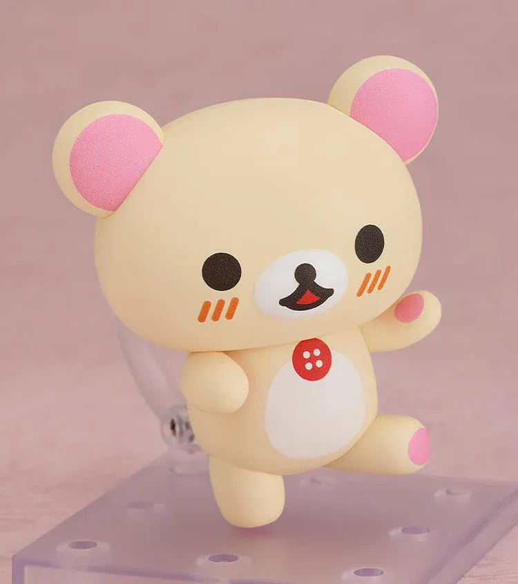 Rilakkuma Nendoroid Korilakkuma Figure with cream-colored bear design, pink ears, red button detail, white belly, and chibi display base