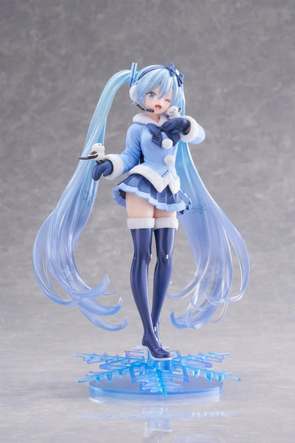 Vocaloid AMP+ Snow Miku All Stars 2012 Ver. Figure with icy blue twin-tails, winter outfit, bird details, and snowflake display base