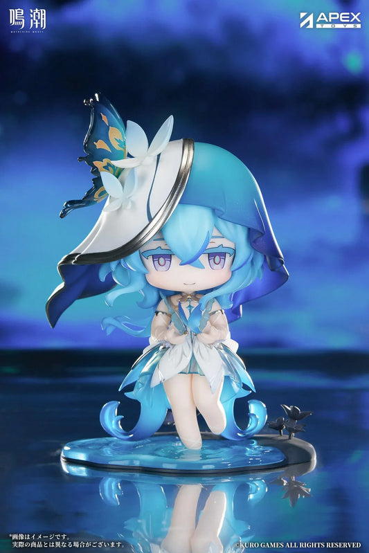 Chibi Shorekeeper Jinseki Series figure with blue hair, a butterfly-decorated headpiece, and a blue butterfly held in her hands, standing on a water-inspired base.