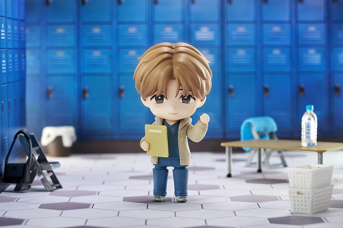 Jinx Nendoroid Kim Dan Figure featuring Kim Dan in a chibi style with brown hair, a casual outfit, yellow notebook, and black shoulder bag.