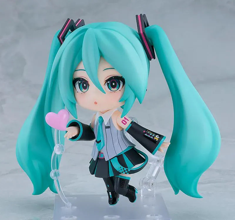 Hatsune Miku V6 Nendoroid figure with turquoise twin tails, an updated outfit, and interchangeable accessories.