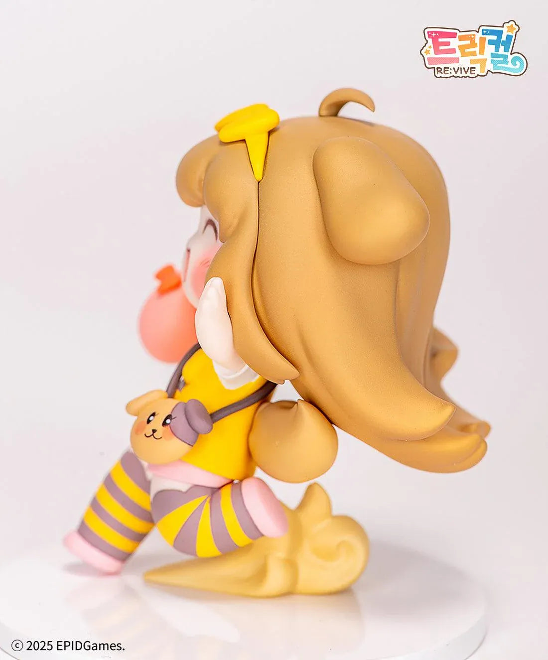 Trickal Chibi Go Butter Non Scale Figure (Rerelease) featuring a cheerful brown-haired character with floppy dog ears, a yellow bow, pink shorts, striped stockings, and a puppy-shaped shoulder bag.
