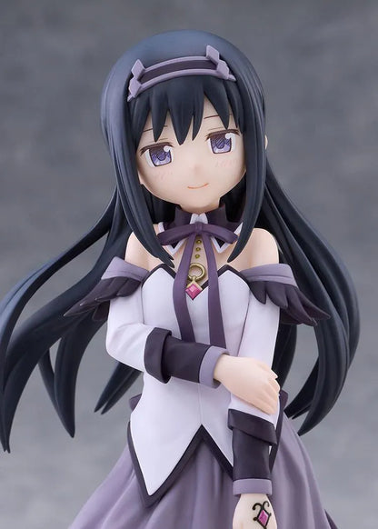 Homura Akemi figure with long black hair, violet eyes, a white and purple outfit, and diamond-patterned stockings, smiling with one hand resting on her arm.