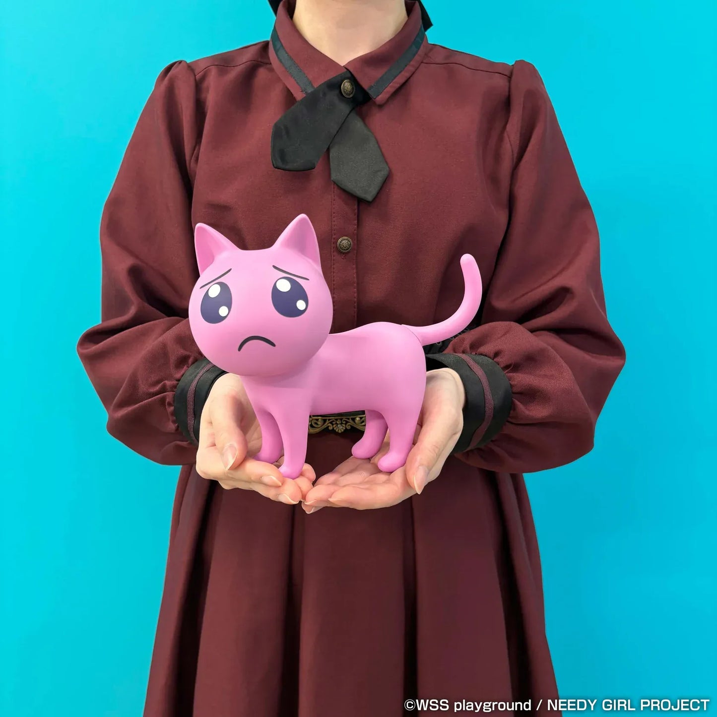NEEDY GIRL OVERDOSE Pien Cat pink soft vinyl figure with large teary eyes and a worried expression.
