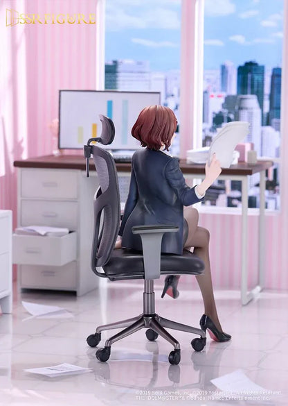 Madoka Higuchi Effortless Work Ver. figure seated in an office chair, wearing a navy blazer and holding papers above a clear circular base.