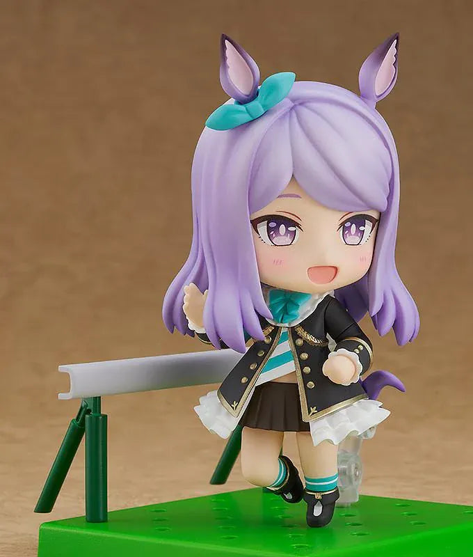 Umamusume Pretty Derby Nendoroid Mejiro McQueen rerelease figure with lavender hair, horse ears, and a black-and-teal racing uniform.