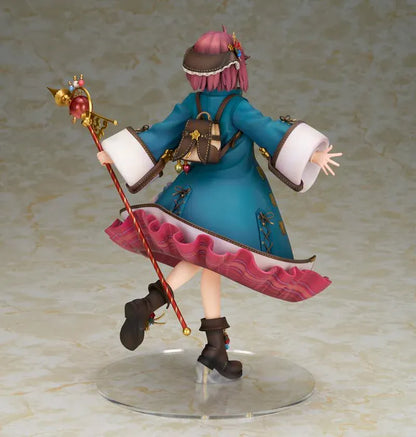 Sophie Neuenmuller figure smiling in a dynamic pose, wearing a teal coat over a red outfit and holding an ornate gold staff with a red orb.
