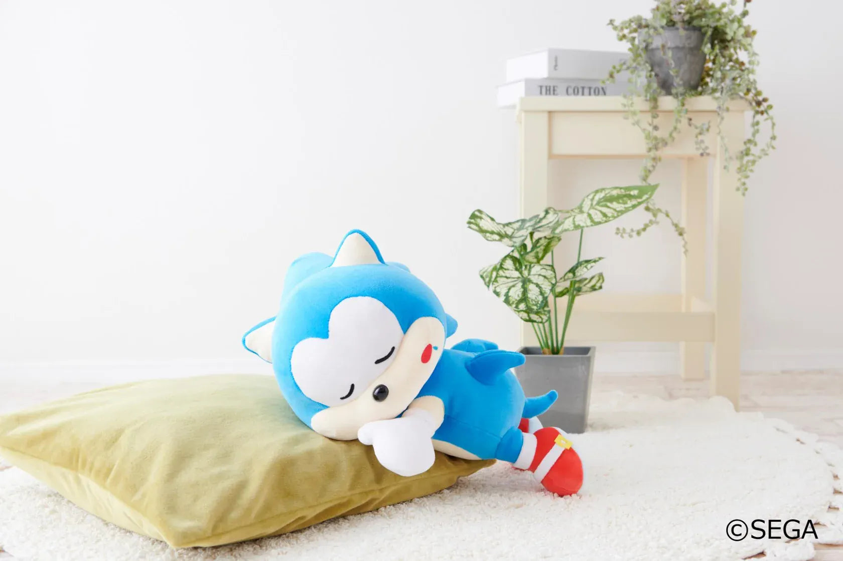 Sonic & Friends Sonic sleeping plush lying on his side with closed eyes, white gloves, and red shoes.
