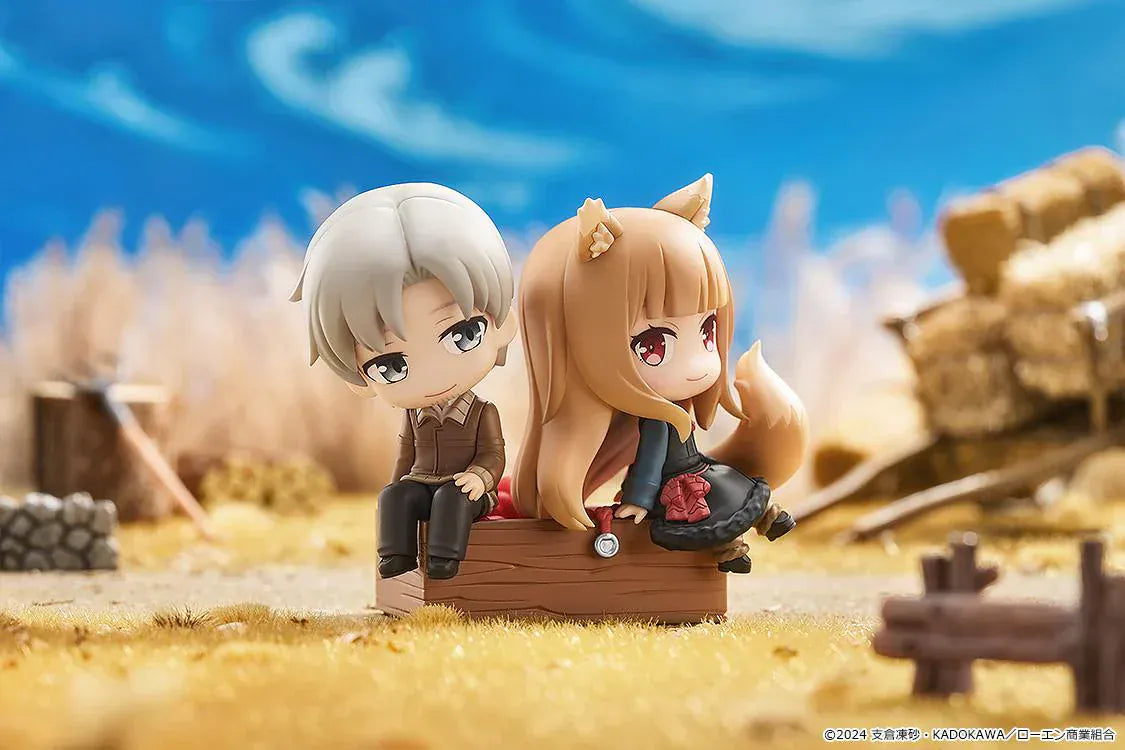 Spice and Wolf Mini Memory Lawrence and Holo chibi figure set sitting on a wooden crate base