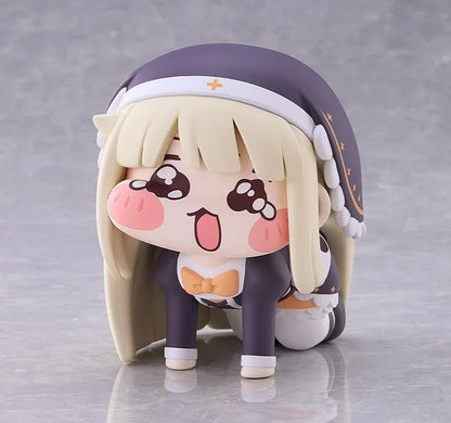 Petite Speaki soft vinyl figure with blonde hair, rosy cheeks, sparkling eyes, and a dark hood with gold accents.