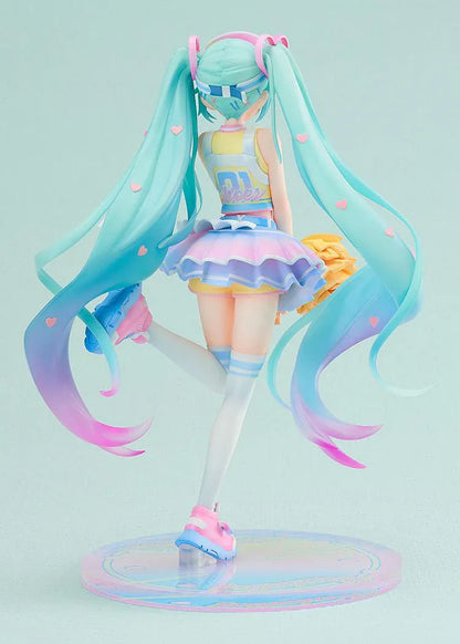 Hatsune Miku Cheerleading Ver. 1/7 scale figure holding yellow pom-poms, with turquoise twin-tails, a pastel outfit, and one leg lifted.