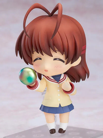 CLANNAD Nendoroid Nagisa Furukawa Figure featuring Nagisa in a chibi-style design with brown hair, cream cardigan, blue skirt, and school uniform details.
