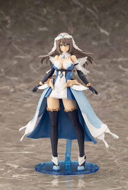 Assembled Arcanadea Ermeda model kit with long brown hair, white feathered wings, a blue and white outfit, gold armor accents, and armored boots.