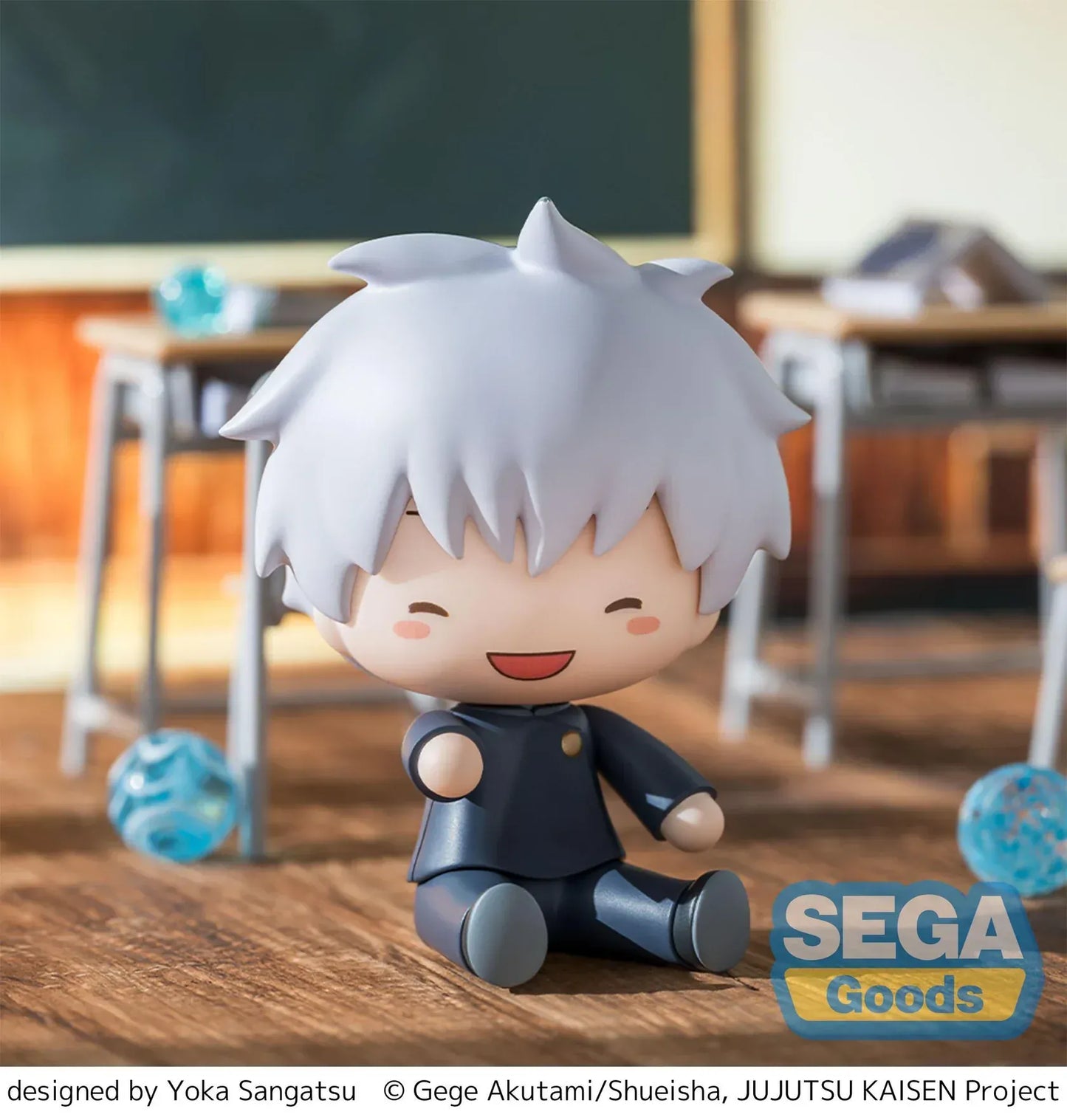 Chibi Satoru Gojo Fuwa Petit figure sitting on the floor with blue glasses and fluffy white hair from Jujutsu Kaisen.