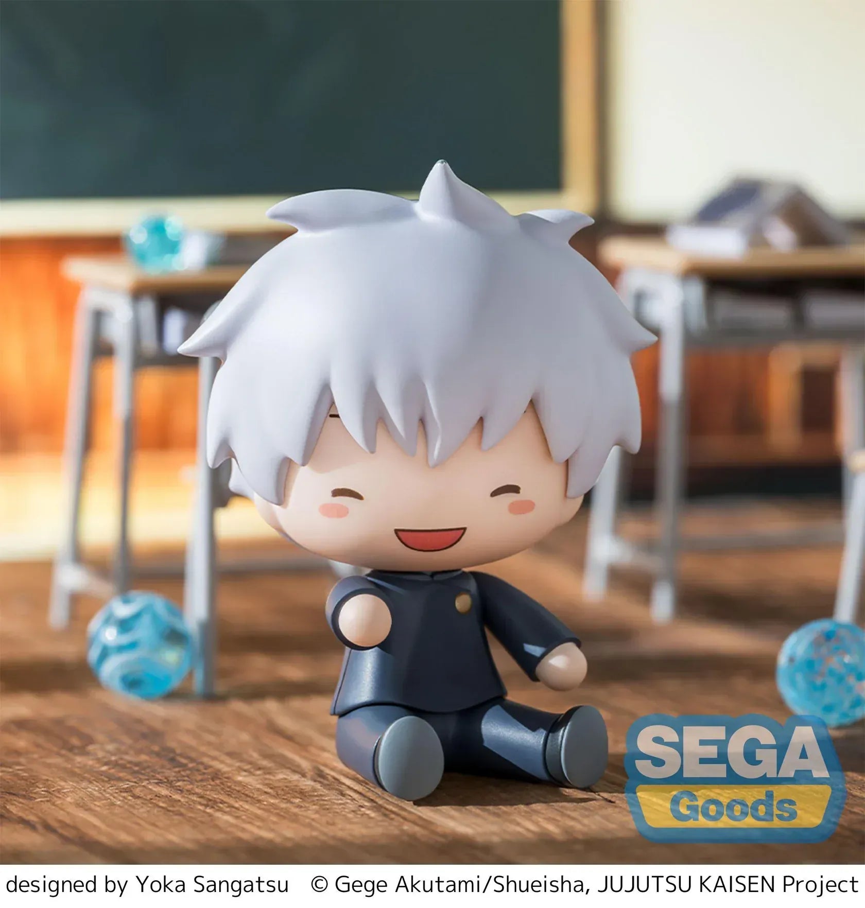 Chibi Satoru Gojo Fuwa Petit figure sitting on the floor with blue glasses and fluffy white hair from Jujutsu Kaisen.