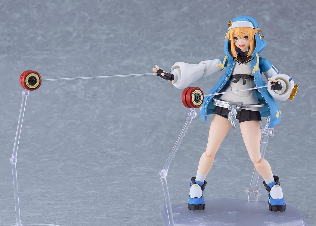 GUILTY GEAR STRIVE figma Bridget Figure featuring Bridget in a blue hoodie outfit with yo-yo accessory, oversized handcuff detail, and teddy bear companion.