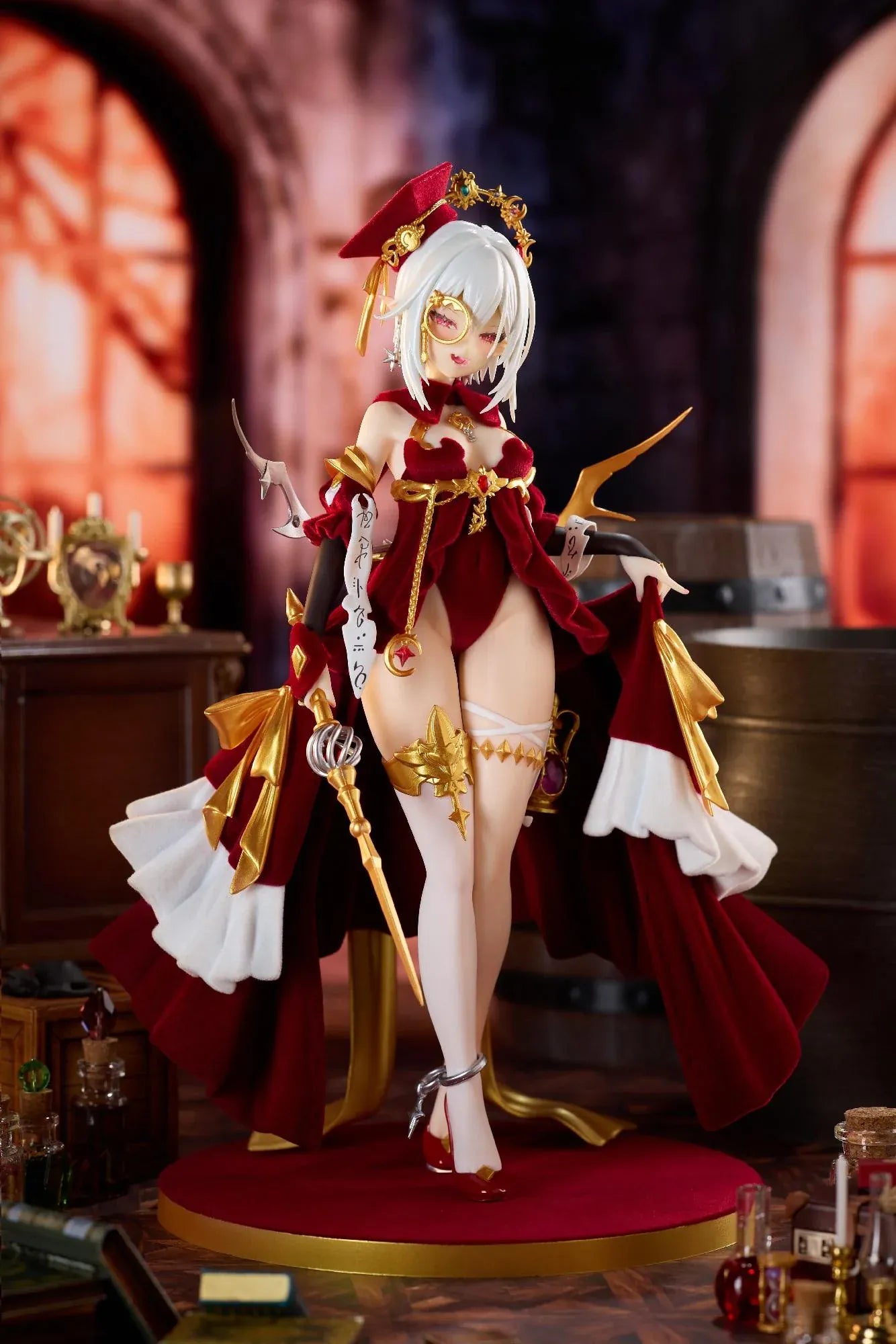 Alchemist Formal Dress Ver. 1/7 Scale Figure featuring a white-haired character in a red formal dress with gold accessories, ornate staff, cape, and red display base.