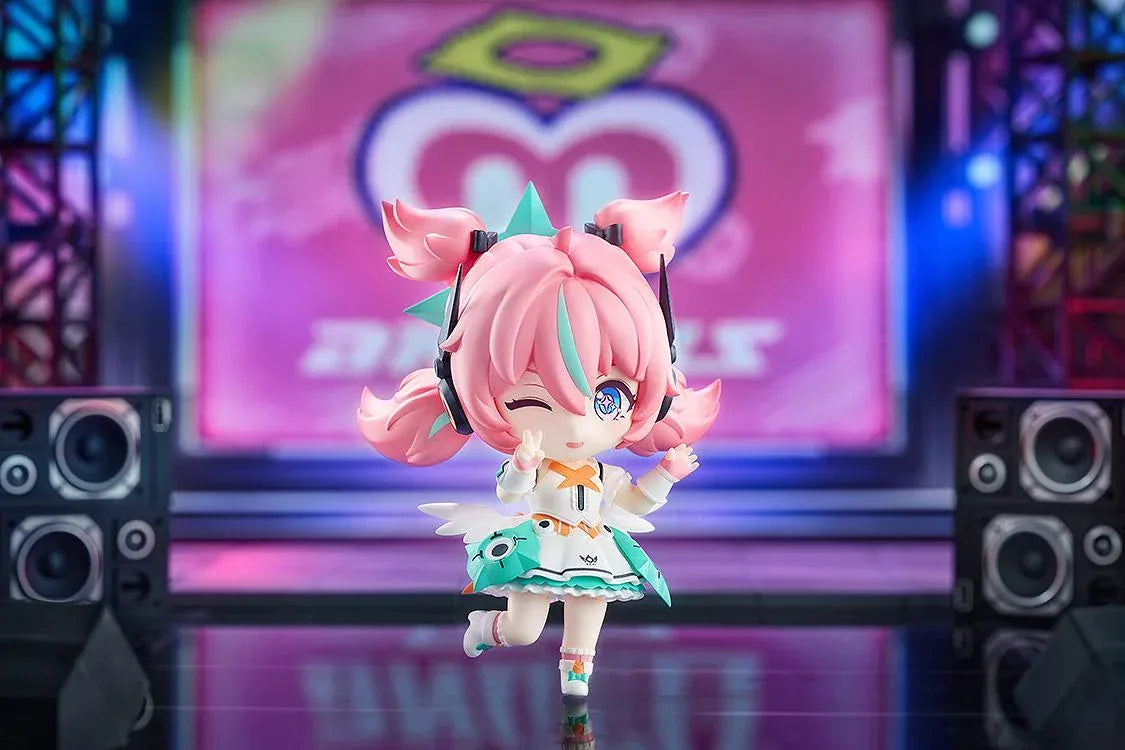 Zenless Zone Zero Nendoroid Aria figure with pink twin tails, a futuristic headset, and a white-and-teal idol outfit.