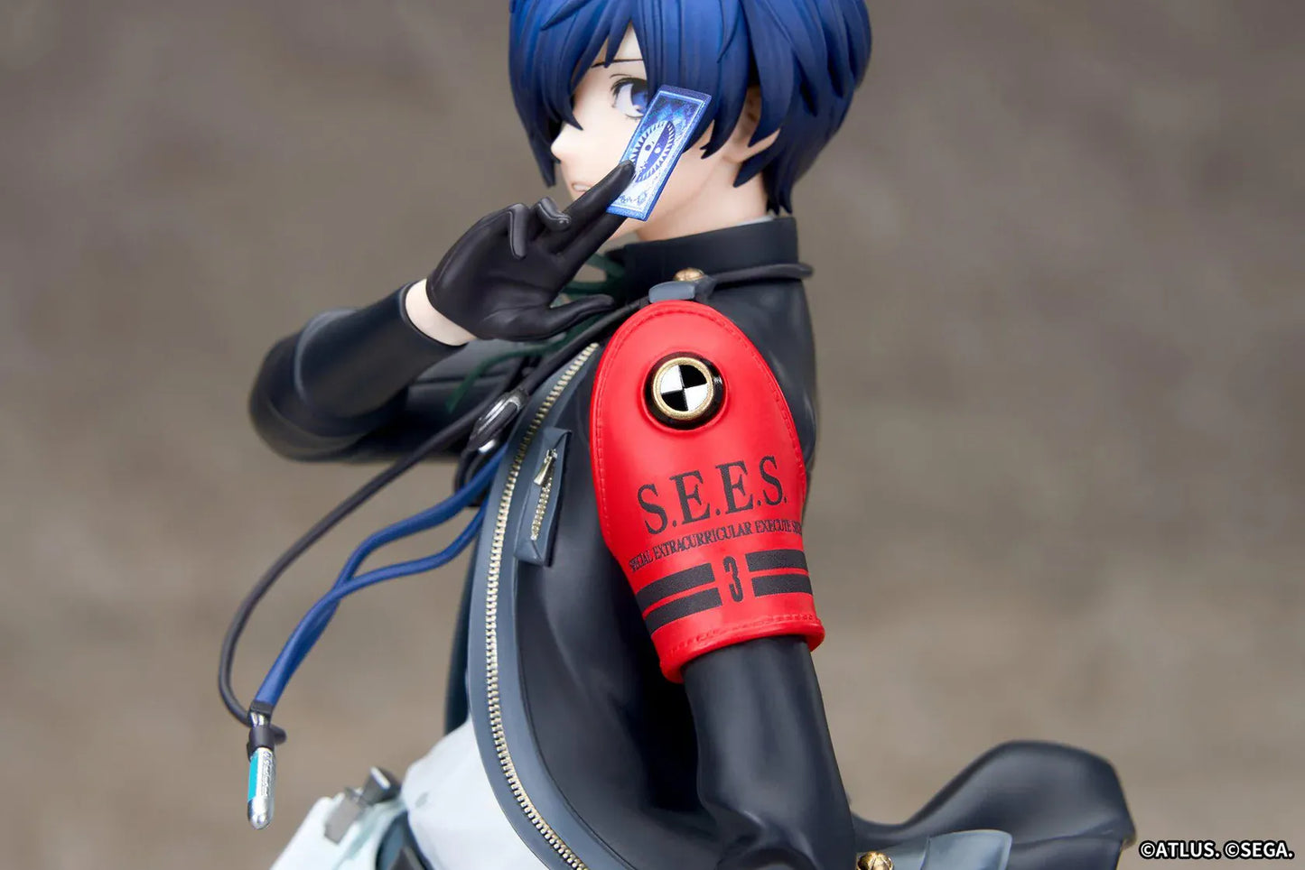 Persona 3 Reload Limepie Protagonist 1/8 Scale Figure with blue hair, black jacket, S.E.E.S. armband, headphones, and themed display base