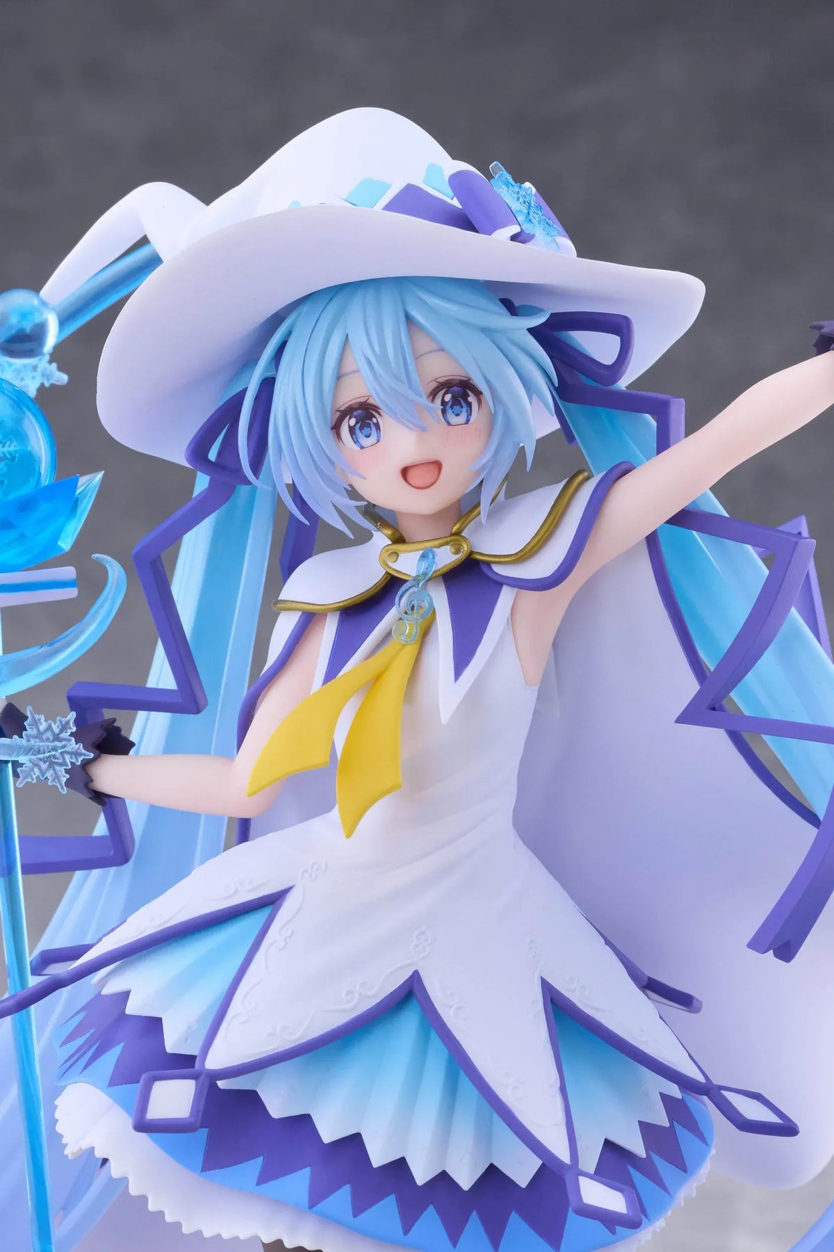 Snow Miku All Stars 2014 Ver. AMP+ figure wearing a white-and-blue snow sorceress outfit and holding a translucent magical staff.
