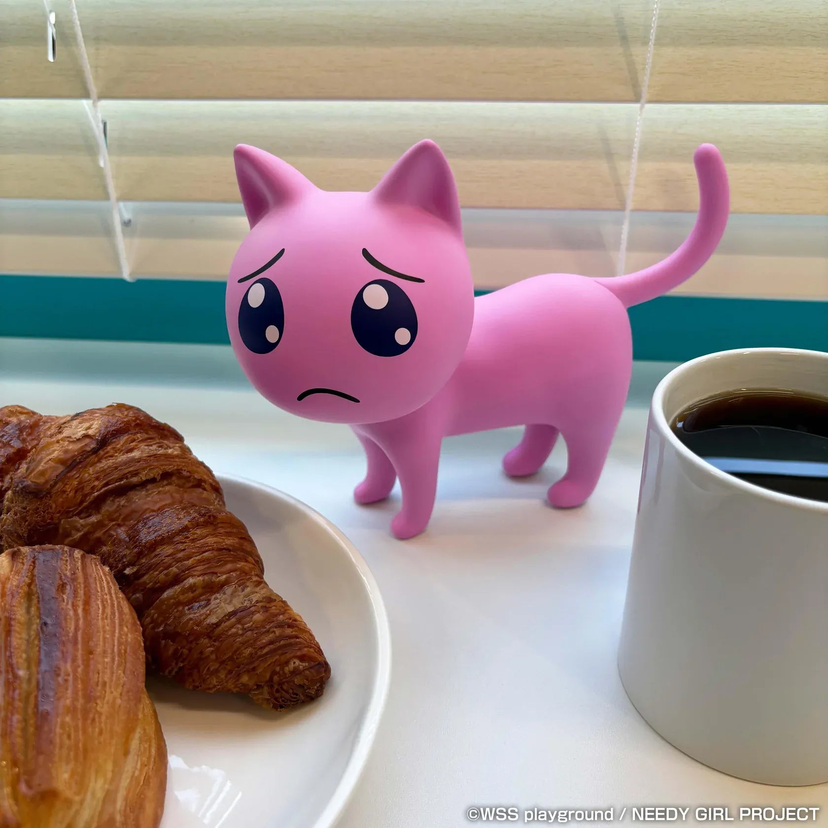 NEEDY GIRL OVERDOSE Pien Cat pink soft vinyl figure with large teary eyes and a worried expression.