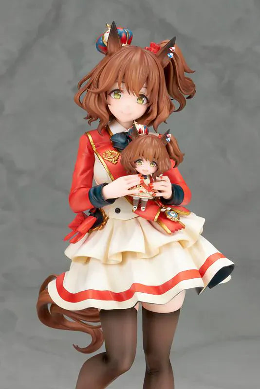 UmaMusume Pretty Derby Aston Machan 1/7 Scale Figure featuring Aston Machan with horse ears, short brown hair, red-and-cream outfit, plush doll accessory, and themed display base.