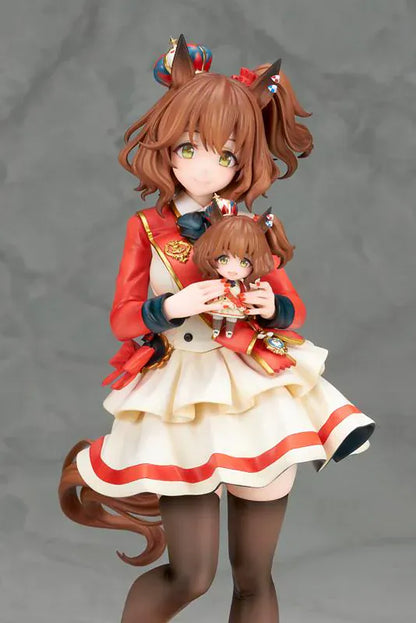 UmaMusume Pretty Derby Aston Machan 1/7 Scale Figure featuring Aston Machan with horse ears, short brown hair, red-and-cream outfit, plush doll accessory, and themed display base.