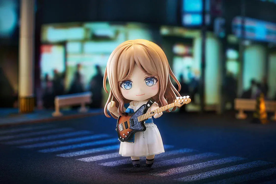 Nendoroid figure of Soyo Nagasaki from BanG Dream! holding a sunburst bass guitar, wearing a blue dress with a white skirt and black shoes.