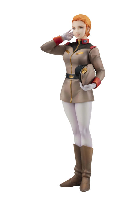 Gundam Girls Generation Matilda Ajan figure saluting in a tan military uniform and peaked cap, holding a green folder, with white trousers and brown boots.