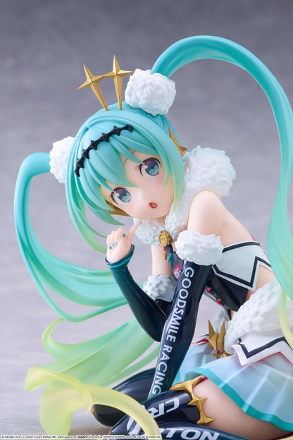 Racing Miku 2018 Ver. Round 8 figure seated in a white, black, and turquoise racing outfit with long gradient twin tails.