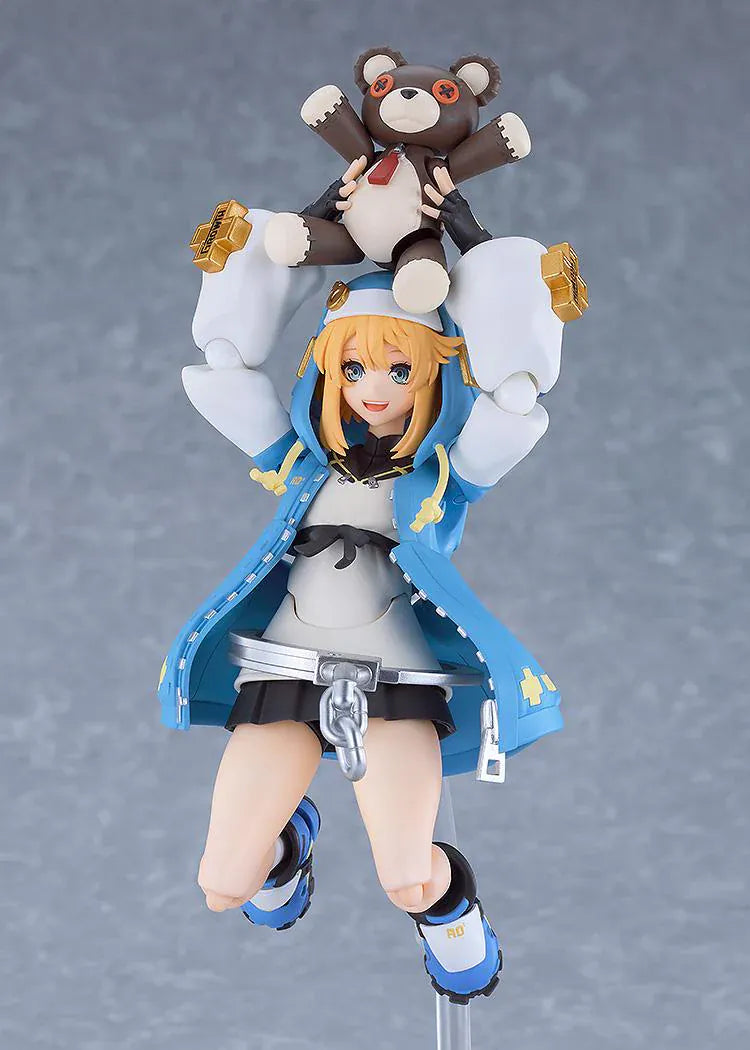GUILTY GEAR STRIVE figma Bridget Figure featuring Bridget in a blue hoodie outfit with yo-yo accessory, oversized handcuff detail, and teddy bear companion.