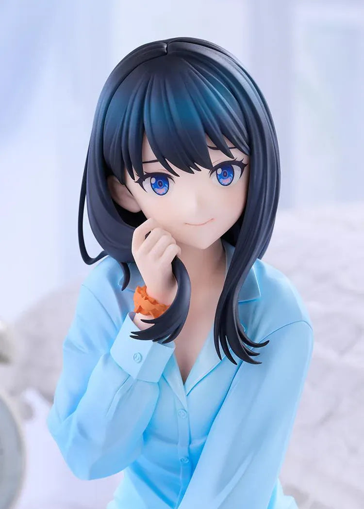 GRIDMAN UNIVERSE Rikka Takarada Pajamas Ver. figure seated in light blue pajamas, with dark hair, blue eyes, and an orange wrist scrunchie.