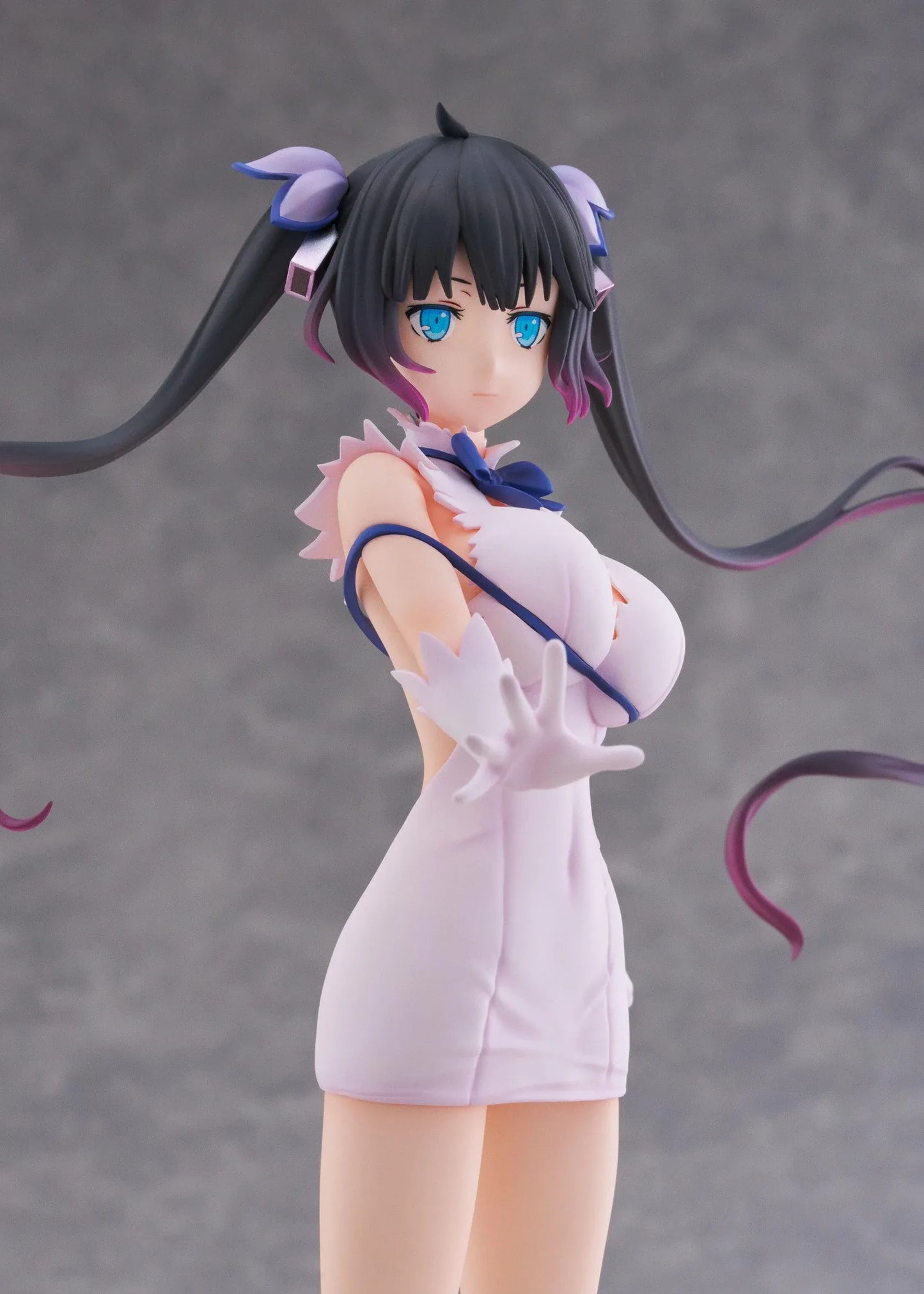 Is It Wrong to Try to Pick Up Girls in a Dungeon V Hestia Divinity Unleashed Limited Edition Ver. 1/7 Scale Figure with twin-tails, white outfit, blue ribbon accents, rocky base, and flame effect parts