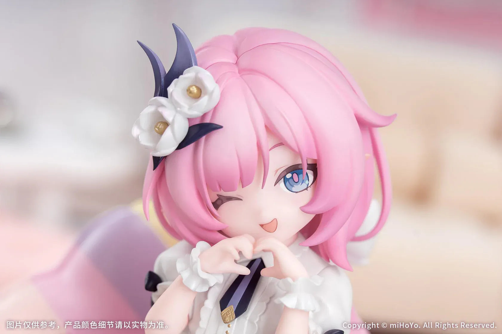 Honkai Impact 3rd Little Series Elysia Little Flame-Chaser Ver. Figure featuring Elysia with pink hair, chibi styling, black-and-white outfit, purple bow accents, and pastel heart cushion.