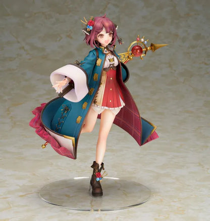 Sophie Neuenmuller figure smiling in a dynamic pose, wearing a teal coat over a red outfit and holding an ornate gold staff with a red orb.