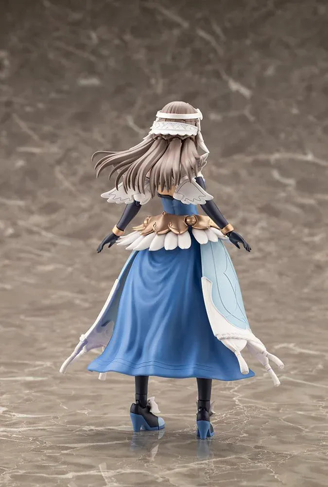 Assembled Arcanadea Ermeda model kit with long brown hair, white feathered wings, a blue and white outfit, gold armor accents, and armored boots.