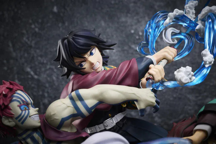 Demon Slayer Tanjiro Kamado, Giyu Tomioka, and Akaza vignette figure featuring translucent water and fire battle effects.