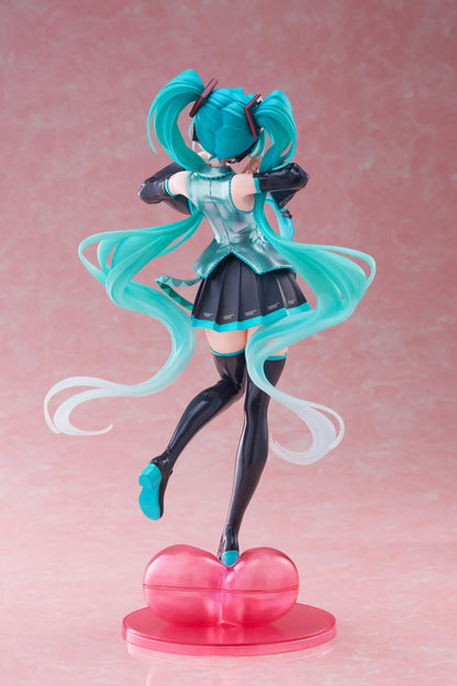 Hatsune Miku T-Most figure with flowing twin tails, classic Vocaloid outfit, and pink heart-shaped display base