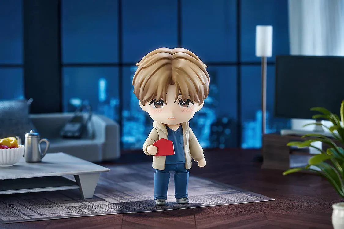 Jinx Nendoroid Kim Dan Figure featuring Kim Dan in a chibi style with brown hair, a casual outfit, yellow notebook, and black shoulder bag.