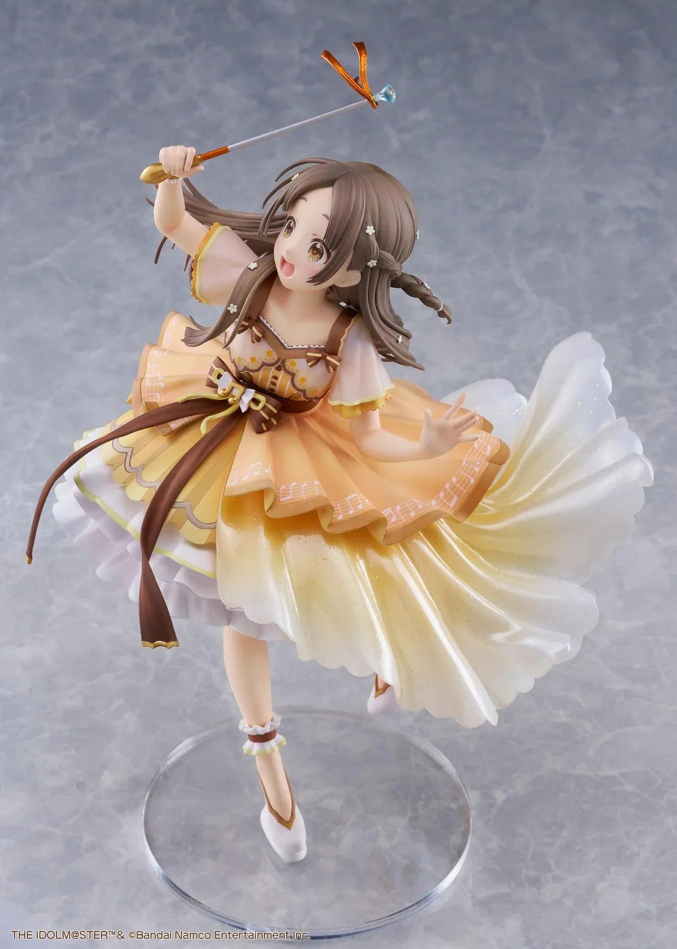 The Idolmaster Gakuen China Kuramoto 1/7 scale anime figure in a flowing yellow stage dress holding a microphone