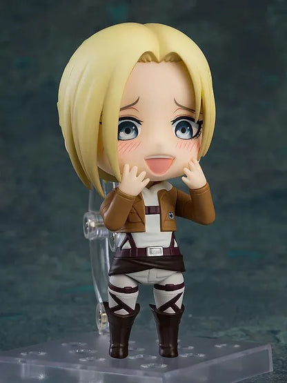 Attack on Titan Nendoroid Annie Leonhart rerelease figure with blonde hair, military uniform, dual blades, and vertical maneuvering equipment.