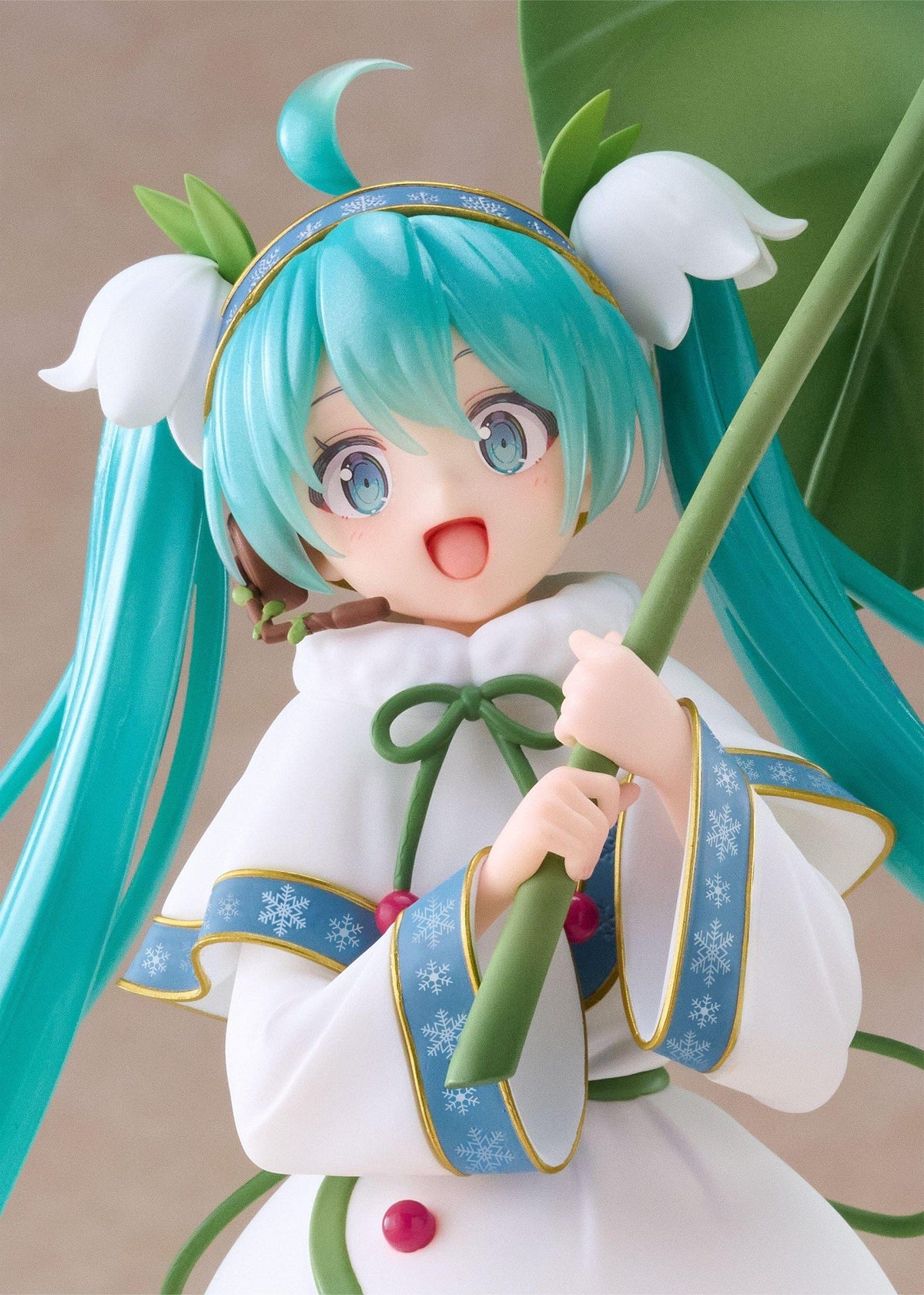 Snow Miku All Stars 2015 Ver. AMP+ figure wearing a white flower-inspired dress and holding an oversized green leaf.