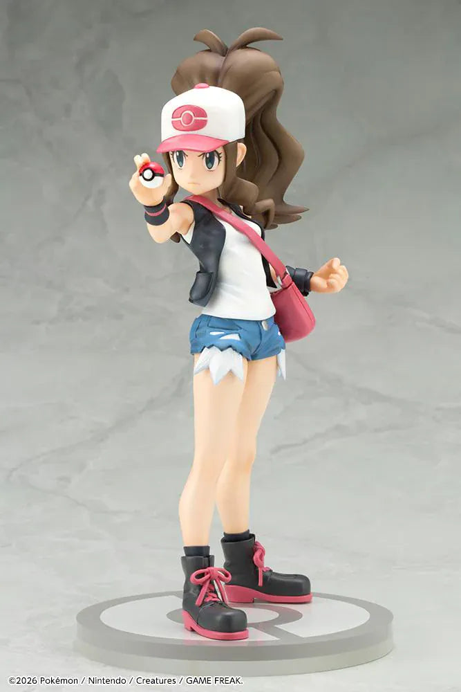 Pokemon ArtFX J Hilda with Tepig 1/8 Scale Figure Rerun featuring Hilda in her trainer outfit holding a Poké Ball with Tepig and flame effect on a display base.