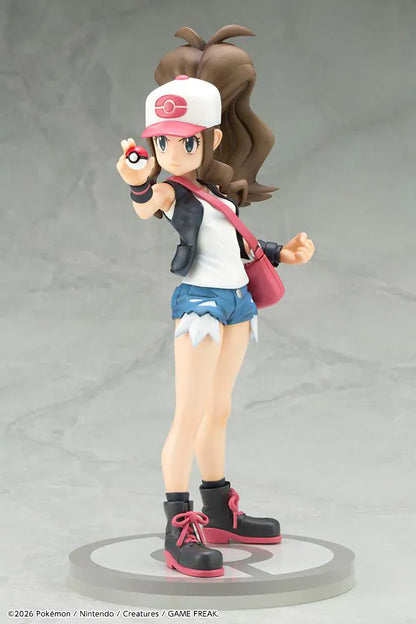 Pokemon ArtFX J Hilda with Tepig 1/8 Scale Figure Rerun featuring Hilda in her trainer outfit holding a Poké Ball with Tepig and flame effect on a display base.