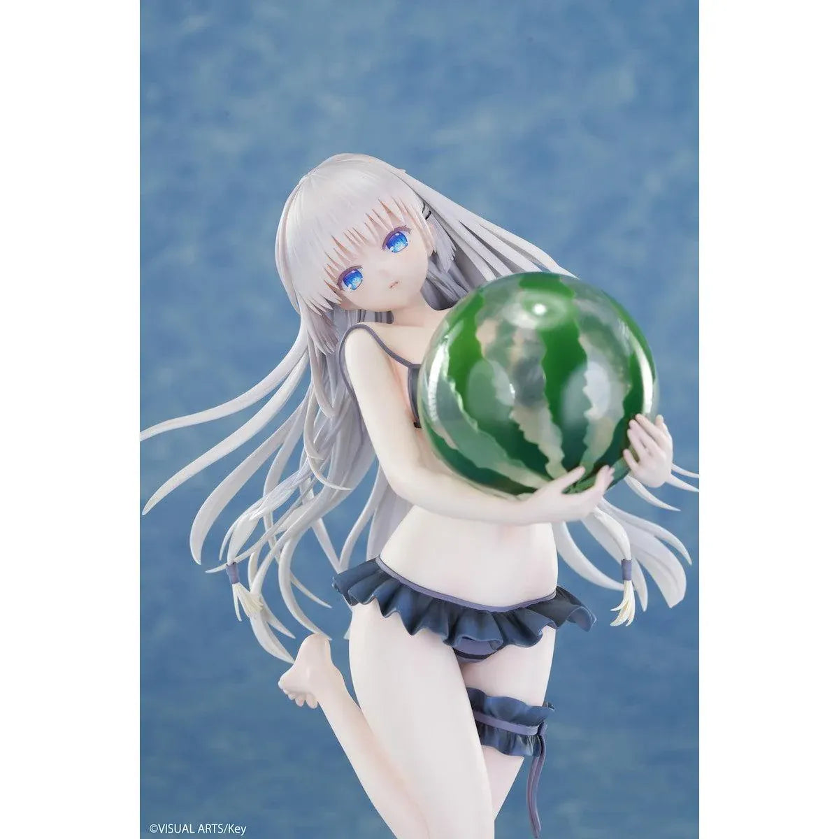 Summer Pockets REFLECTION BLUE Shiroha Naruse 1/6 scale figure wearing a black swimsuit and holding a watermelon on a beach-themed base.