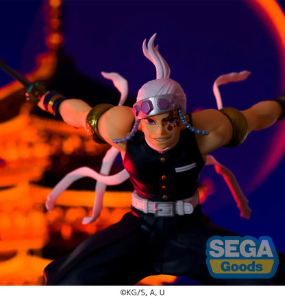 Demon Slayer FIGURIZMα Tengen Uzui figure in a wide stance with twin chained blades extended, a jeweled headband, and gold arm bands on a white base.