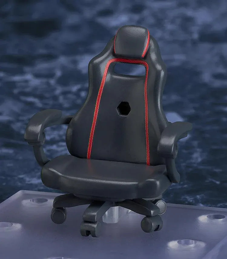 Nendoroid Satone figure seated in a black office chair, wearing red glasses, red headphones, a beige jacket, and dark gray trousers.